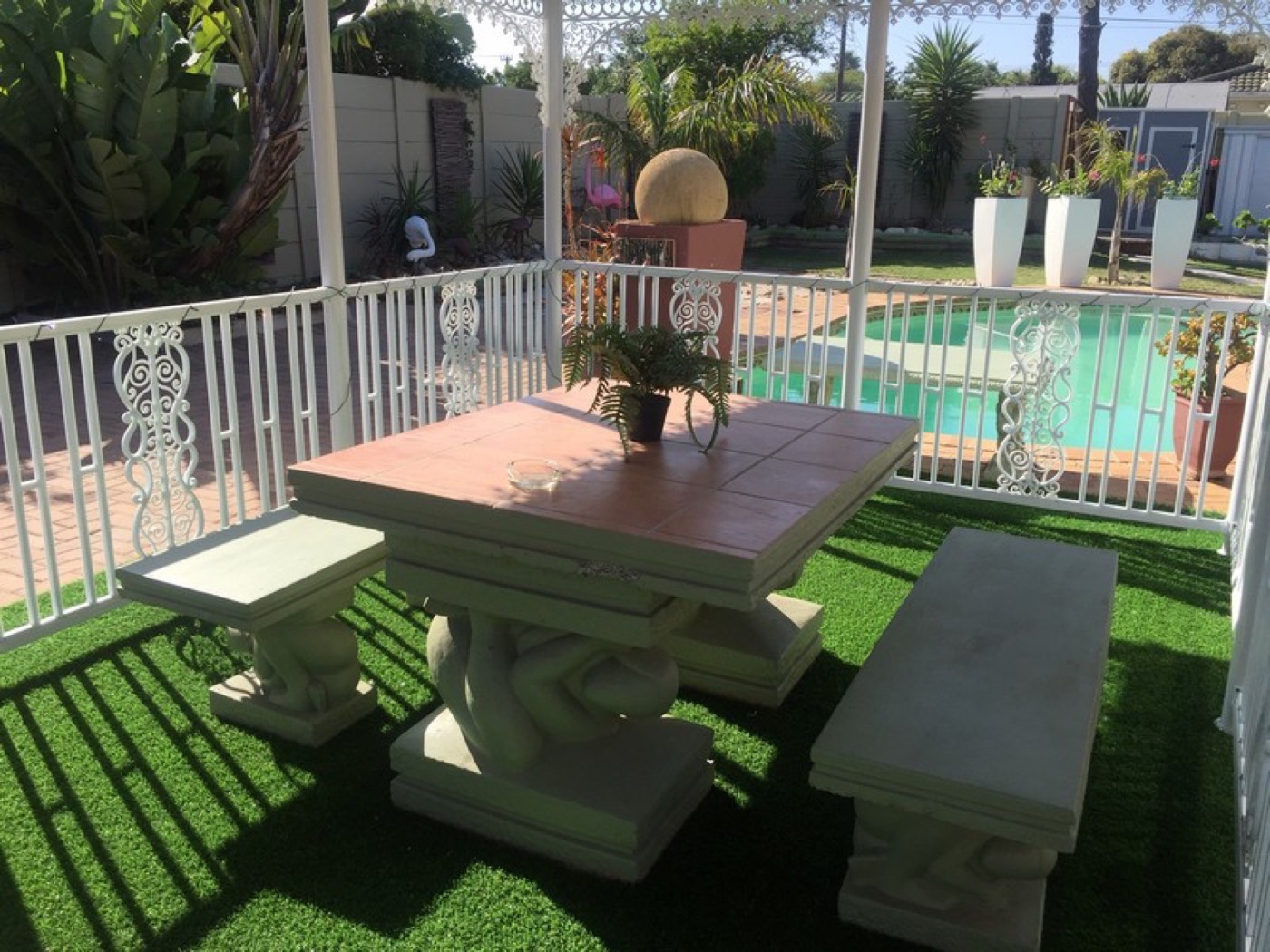 Garden table beside the pool at Arum Field
