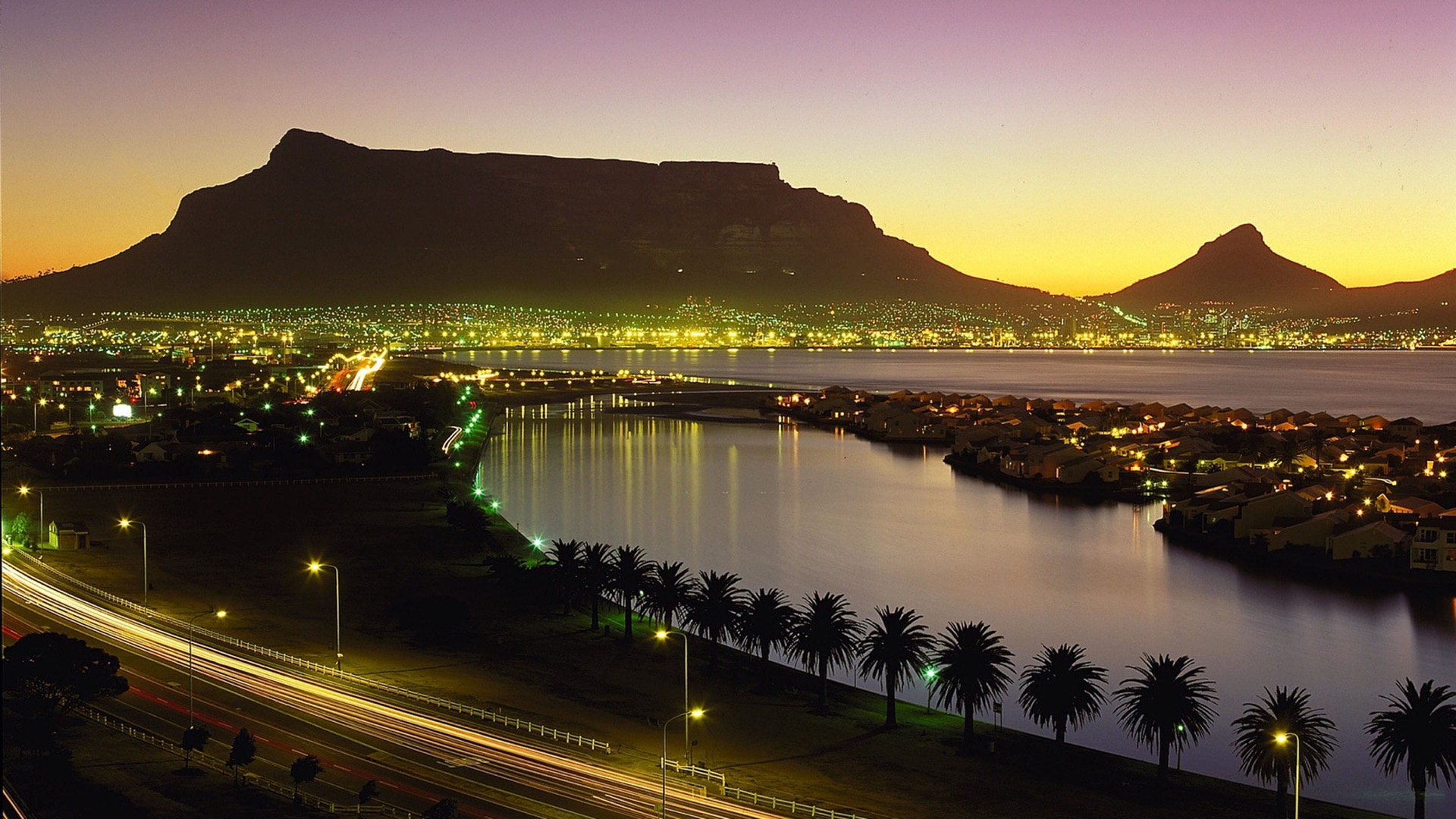 Cape Town city lights and Table Mountain at dusk